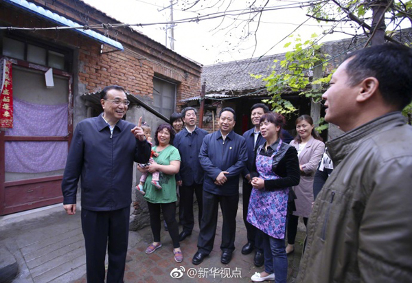 李克强冒雨察看“新”“旧”开封：自贸区要以“新”出彩